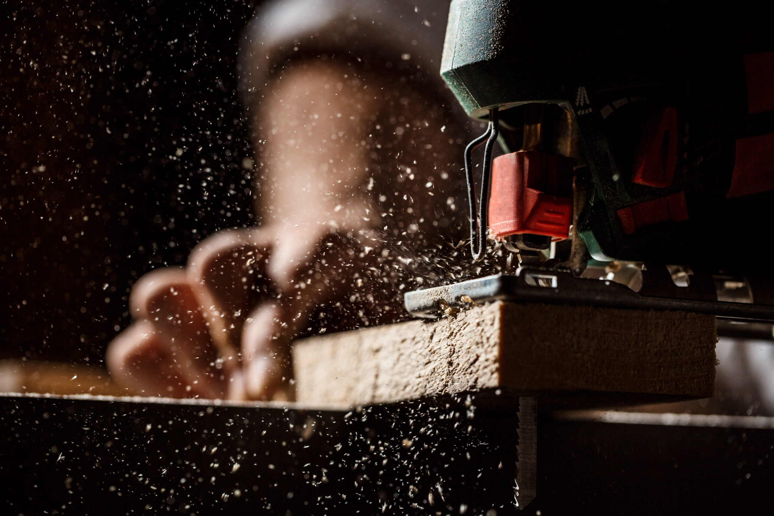 Close up photo of cutting wood with fretsaw.